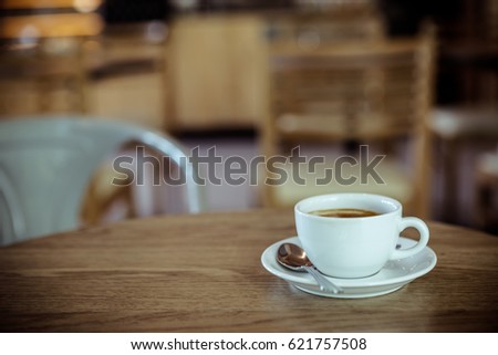 Coffee cup in coffee shop, vintage style effect picture