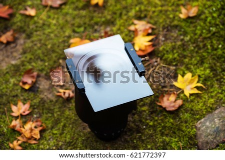 Lense with Graduated Neutral Density (GND) filter and holder for autumn season photo