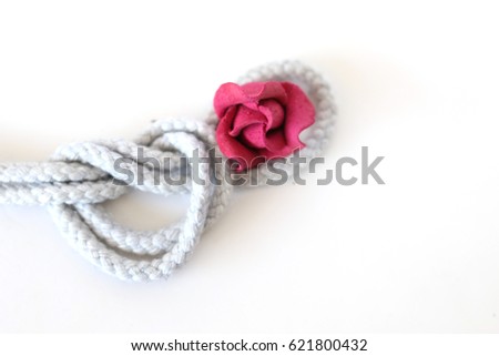 white heart rope and red flower on white back ground, art of rope , rope decorate , love flame, happy valentine , marry