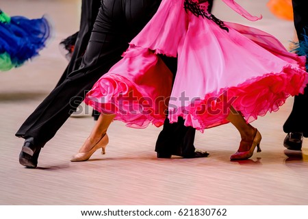 competitions in ballroom dancing. black tailcoat and pink ball gown Royalty-Free Stock Photo #621830762