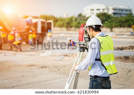 engineer surveyor working with theodolite at construction site Royalty-Free Stock Photo #621830984