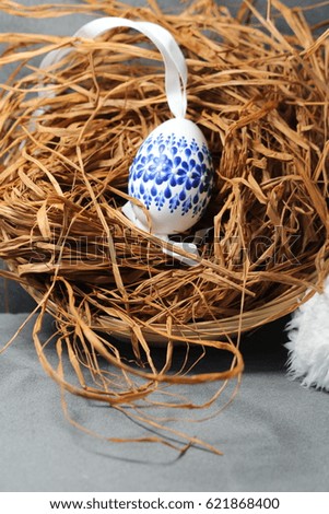 Painted Easter egg/ Easter egg and sheep leather and straw.