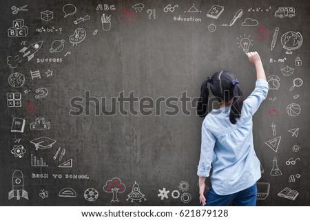 Elementary school kid student drawing doodle with child's imagination for national back to school month, education concept Royalty-Free Stock Photo #621879128