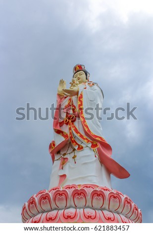 The Biggest Guan yin on white clouds and blue sky background, in Wat Samanrattanaram Temple. CHA CHENG SAO province, Thailand.