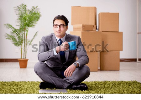 Businessman sitting on office floor