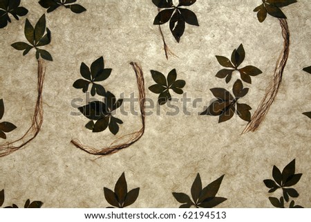 backgrounds and wallpapers of handmade rice paper with organic plant leafs and fibers infused in between the fibers
