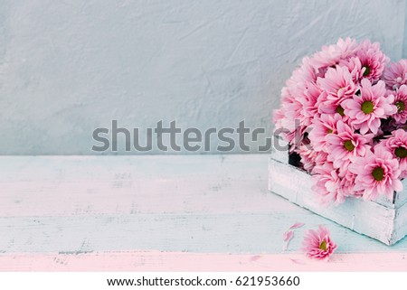 Flowers over wooden background 