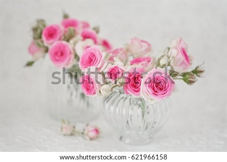 Close-up floral composition with a pink roses .Many beautiful fresh pink roses on a table.