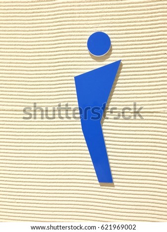 Male symbol blue signage in the wall for men restroom toilet lavatory