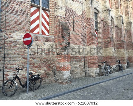 Bicycle park and brick block wall building