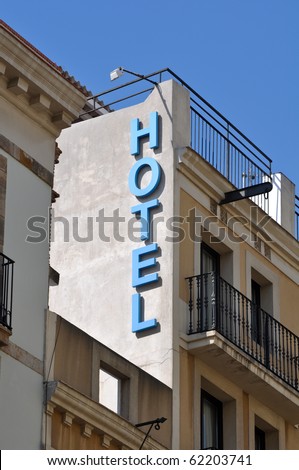 Hotel Sign on Old Building with Blue Sky
