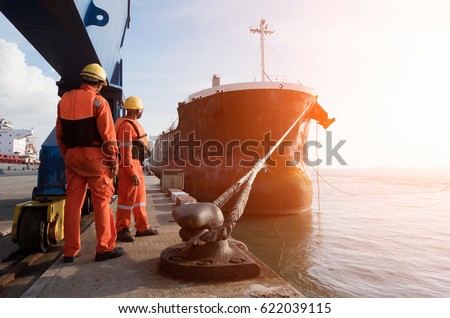 mooring gang in port to departure ship Royalty-Free Stock Photo #622039115