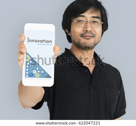 Man holding digital device network graphic overlay 