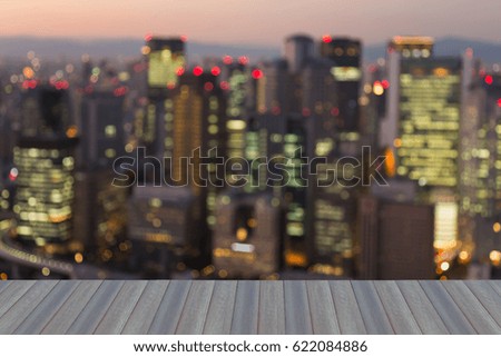 Opening wooden floor, Osaka city blurred bokeh light business downtown, abstract background
