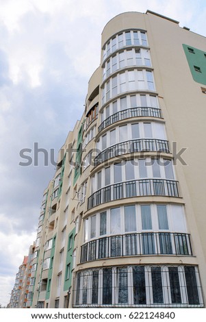 Photo of beautiful green white modern apartment building