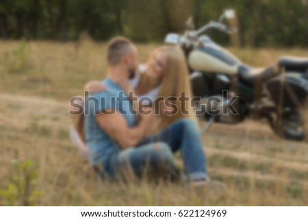 Young couple in a field.Background blur