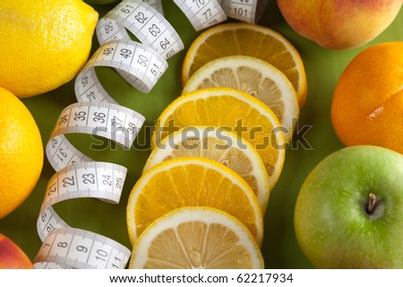 Picture of mixed fruits on the green background