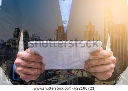 Double exposure of businessman has working with long exposure.