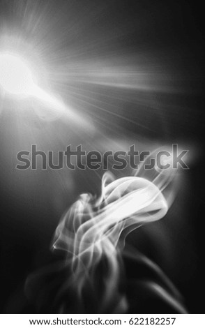A creative black and white smoke and light glare designed background. This photo was taken in Brisbane, Australia. 