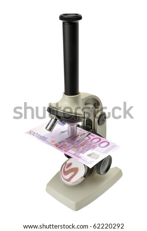 microscope and money isolated on a white background