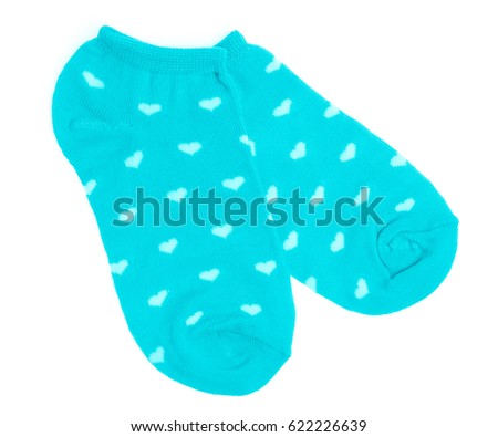 Green socks with white hearts isolated on a white background