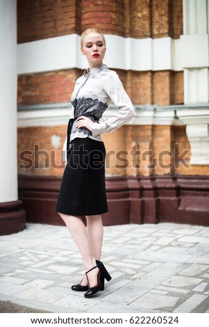 Pretty young business woman wearing formal clothes