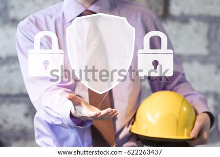 Businessman pushing button locked shield virus security online network