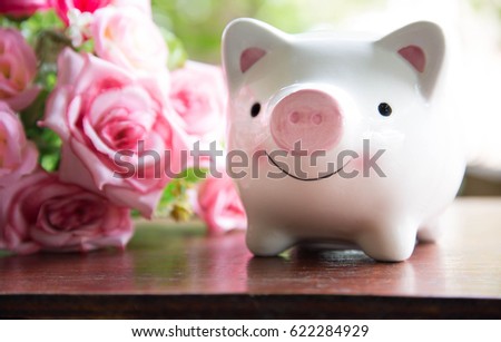 Piggy bank smiling on table,Save money concept,Sepia