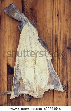 salted cod fish on wooden background