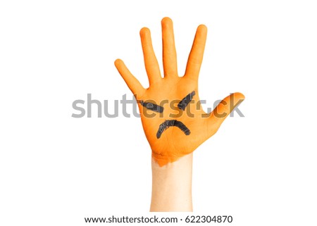 Close up of painted orange child hand with angry face, on isolated white background.