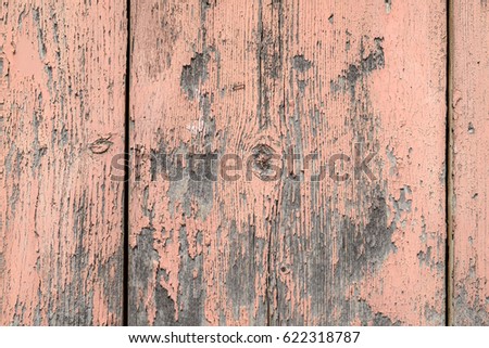 Old brown wooden wall in pink color, detailed background photo texture. Wood plank fence close up.