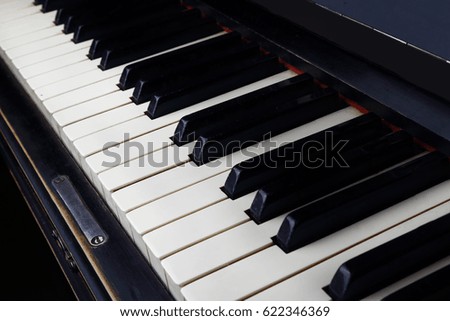 The piano keys. Close-up.
