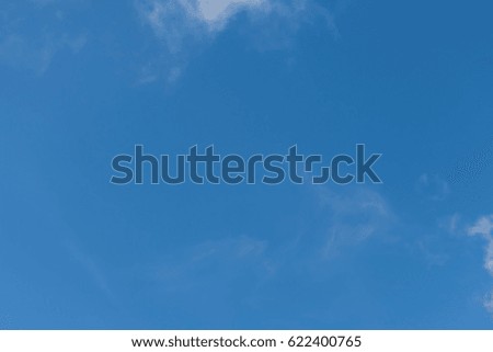 Clear blue sky and white clouds on day time for background. Sky texture.