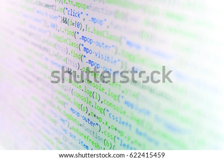 Programming code abstract screen of software developer. HTML5 in editor for website development. Coworkers team in modern office. Writing programming functions on laptop. 
