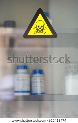 Focus at label toxic chemicals on Chemical cabinet