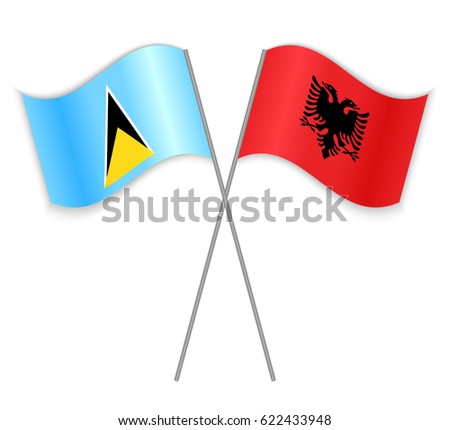 Saint Lucian and Albanian crossed flags. Saint Lucia combined with Albania isolated on white. Language learning, international business or travel concept.
