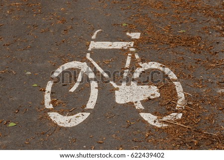 A white image of bicycle on the road in Holland