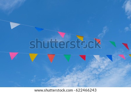 Party flags colorful celebrate abstract on blue sky background