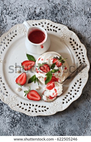 Pavlova dessert with strawberries on top