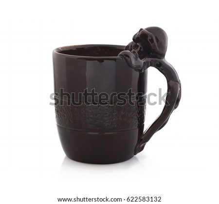 Beer mug of brown clay, with ceramic dash on white background. Isolated