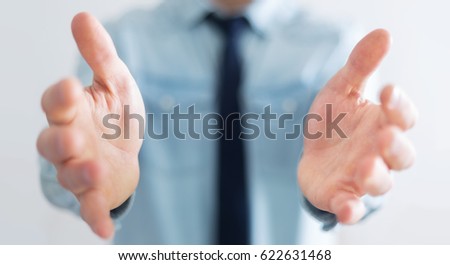 Businessman on blurred background showing his empty hand