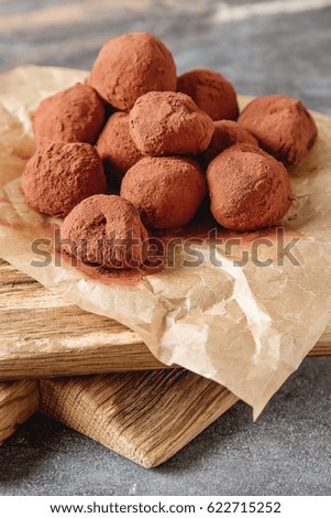 Homemade chocolate truffles with cocoa powder. Copy space. Luxury dessert, velvety smooth chocolate truffles