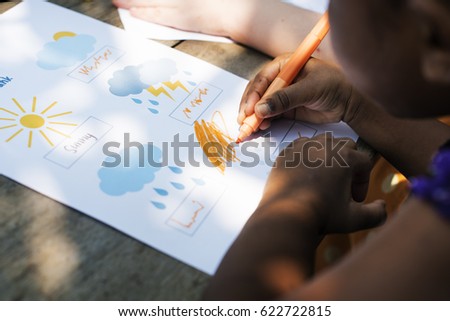 Little girl drawing imagination outdoors