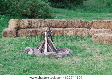 wood for fire. Fireplace in camping area