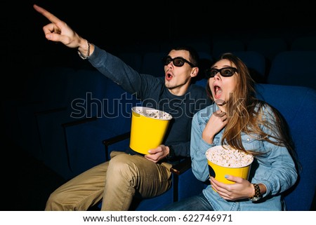Couple looking intresting movie in cinema