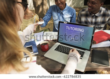 Group of students studying using laptop giving notes