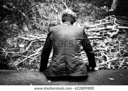 Portrait of business man sitting outdoors on nature background,Lifestyle man