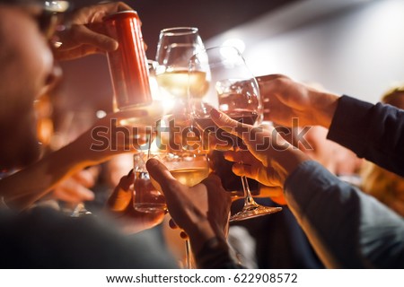 Cheerful friends clinking glasses above dinner table. Alcohol and toasting, party and celebration theme. Congratulations on the event. Royalty-Free Stock Photo #622908572