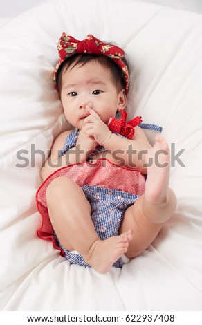 Little Fairy Baby Asian Girl  on white bed