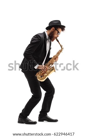 Full length profile shot of a bearded man playing a saxophone isolated on white background Royalty-Free Stock Photo #622946417